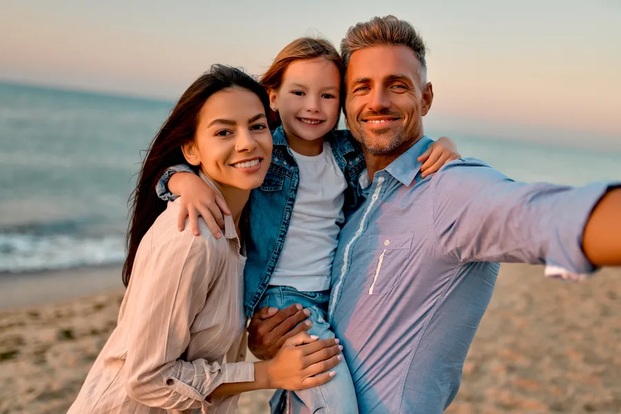 Happy family together at the beach