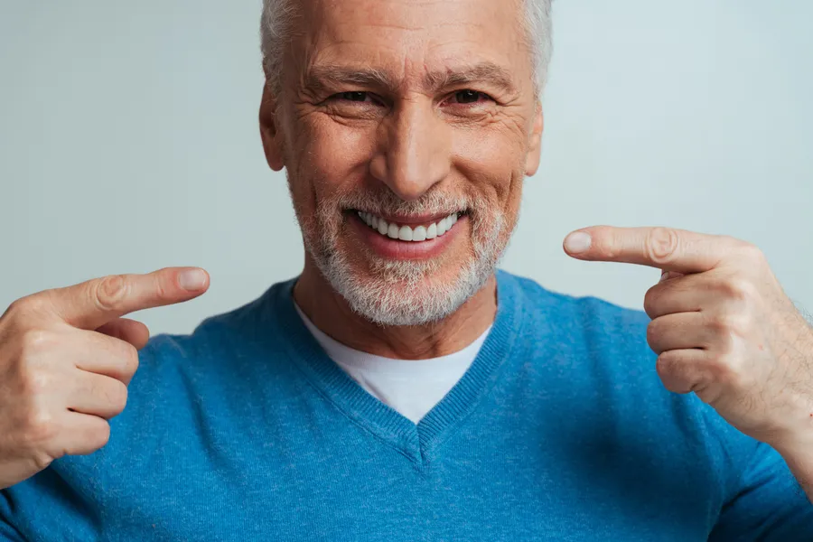 Dental professional examining patient gums