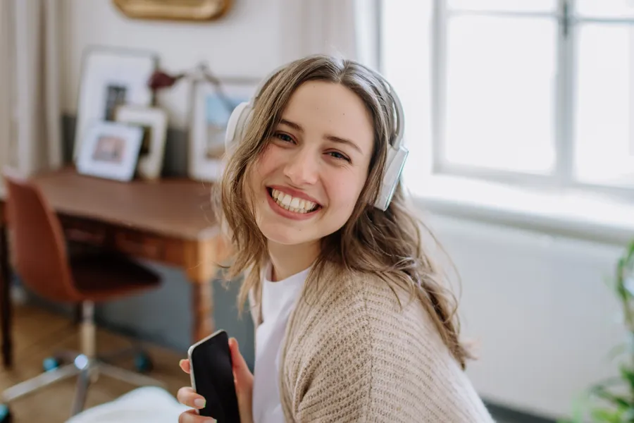 Young woman smiling at home