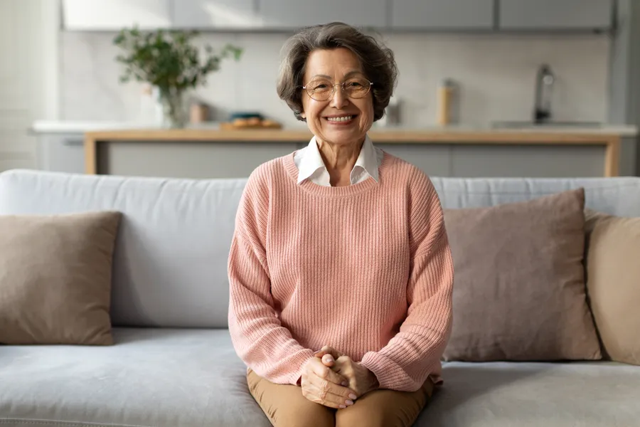 Smiling older woman on couch